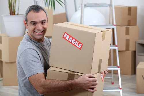 Local removal team loading boxes for a Belsizepark flat move