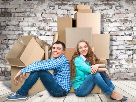 House removalists helping a Belsizepark home move with boxes and furniture