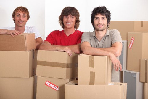 Packed boxes and furniture ready for removal truck hire
