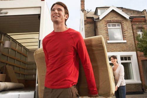 Packed boxes and furniture ready for transport in a Belsize Park property