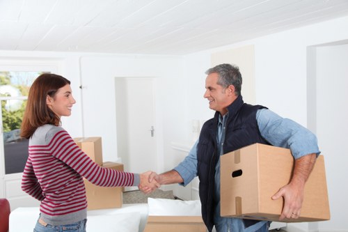 Belsizepark movers planning a residential move with boxes and furniture