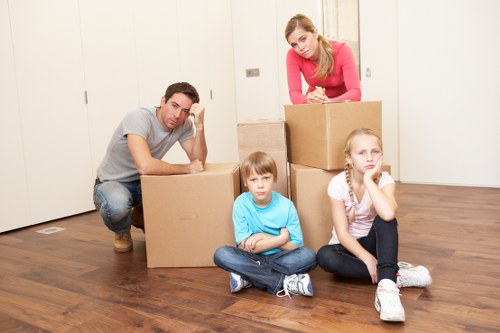 Moving day preparation checklist and packed room for a local relocation