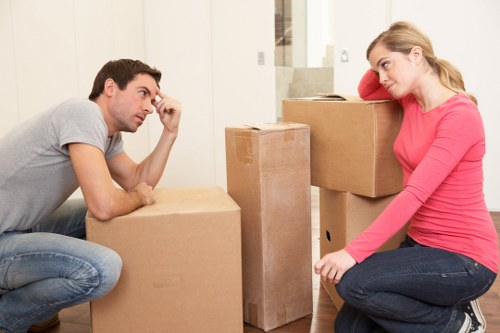 Packed boxes and furniture prepared for a residential move in Belsizepark